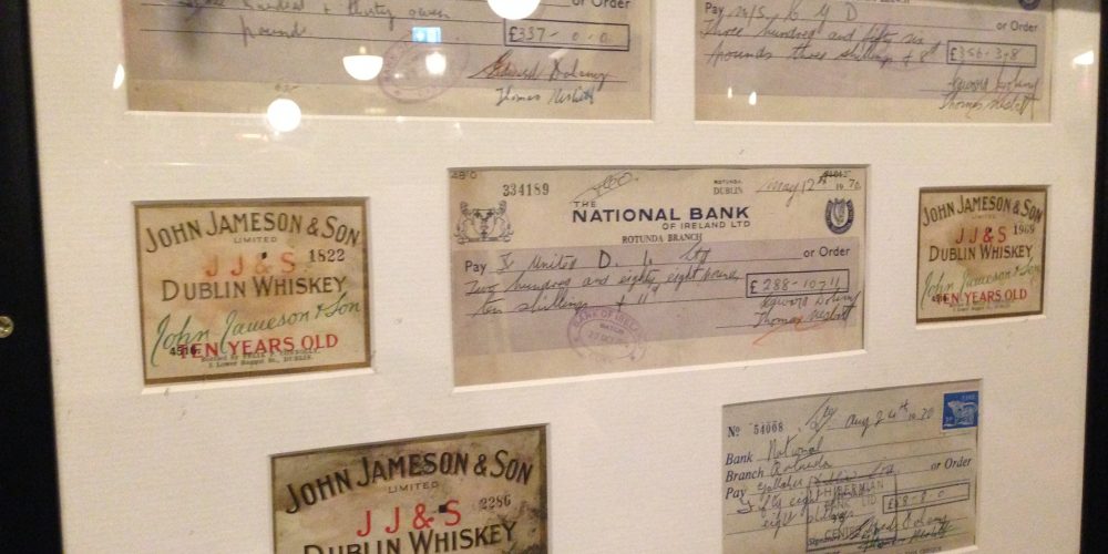 Why are there old framed cheques on the walls of Doheny and Nesbitt?