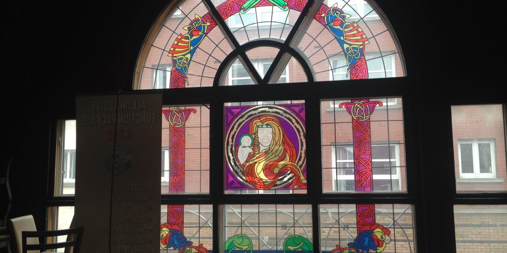 Examples of stained glass artwork in Dublin pubs.