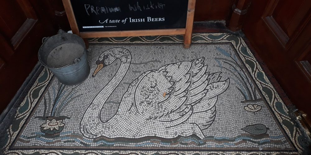 How many Swan icons are in and outside of The Swan Bar?